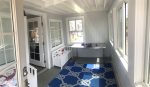 Beautiful 3 season sun porch opens into living room